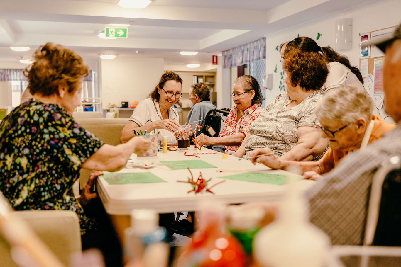 aged care staff and residents doing arts and crafts at st vincent's carseldine